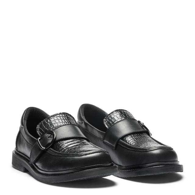 Women's loafers featuring a decorative buckle on a velcro strap