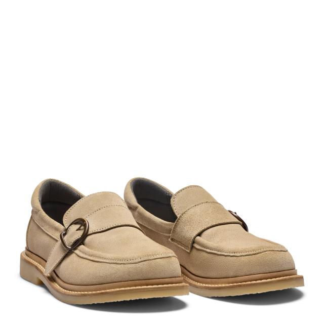 Women's loafers featuring a decorative buckle on a velcro strap