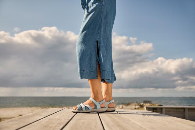 Women's sandal with an adjustable heel strap and three Velcro straps across the foot