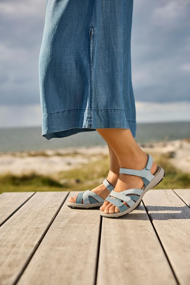 Women's sandal with an adjustable heel strap and three Velcro straps across the foot